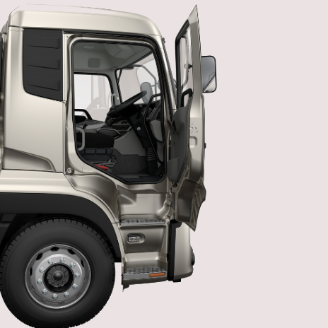 Silver truck cabin with open driver-side door, revealing the interior and steering wheel.