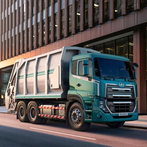 Lori la taka taka kwenye barabara kati ya majengo marefu mjini.