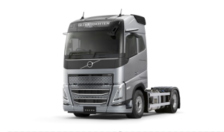 銀色の大型トラックの運転席部分が正面から写っている