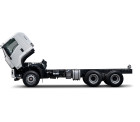 White truck chassis with tilted cab on a white background.
